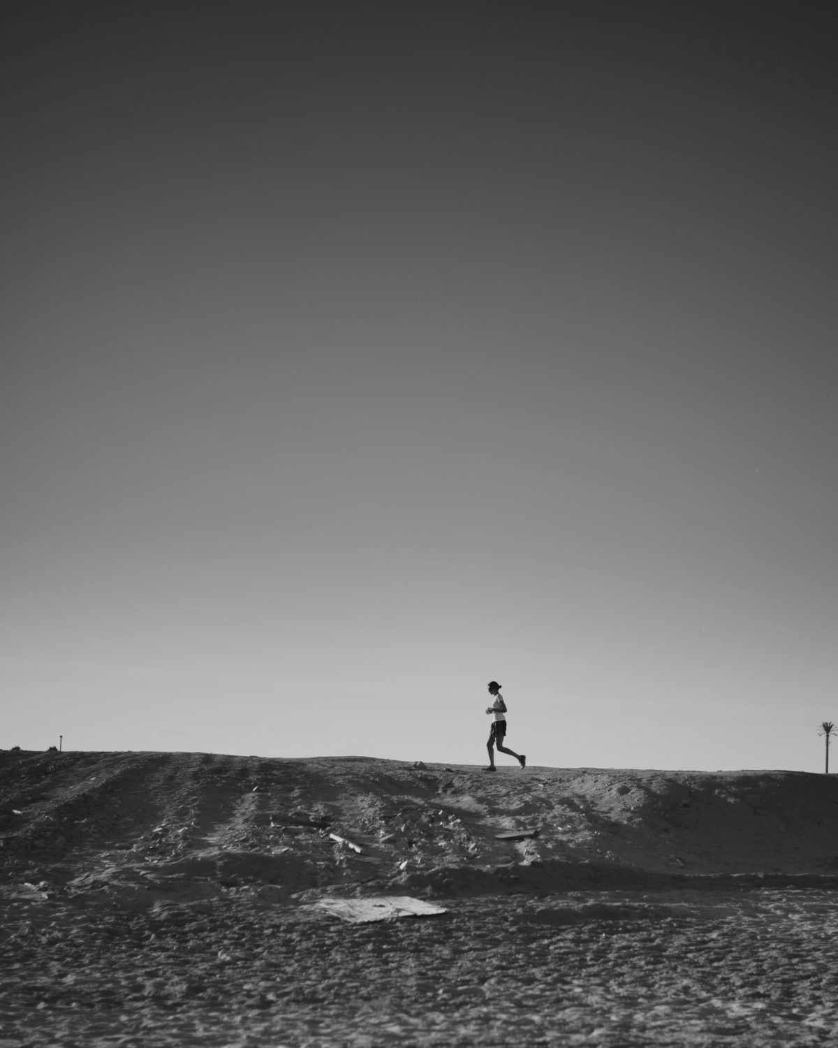 woman on a fitness journey running up a hill in the distance
