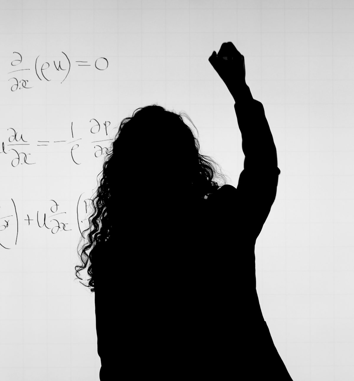 woman writing complex math on whiteboard to show doing math during crossfit is difficult
