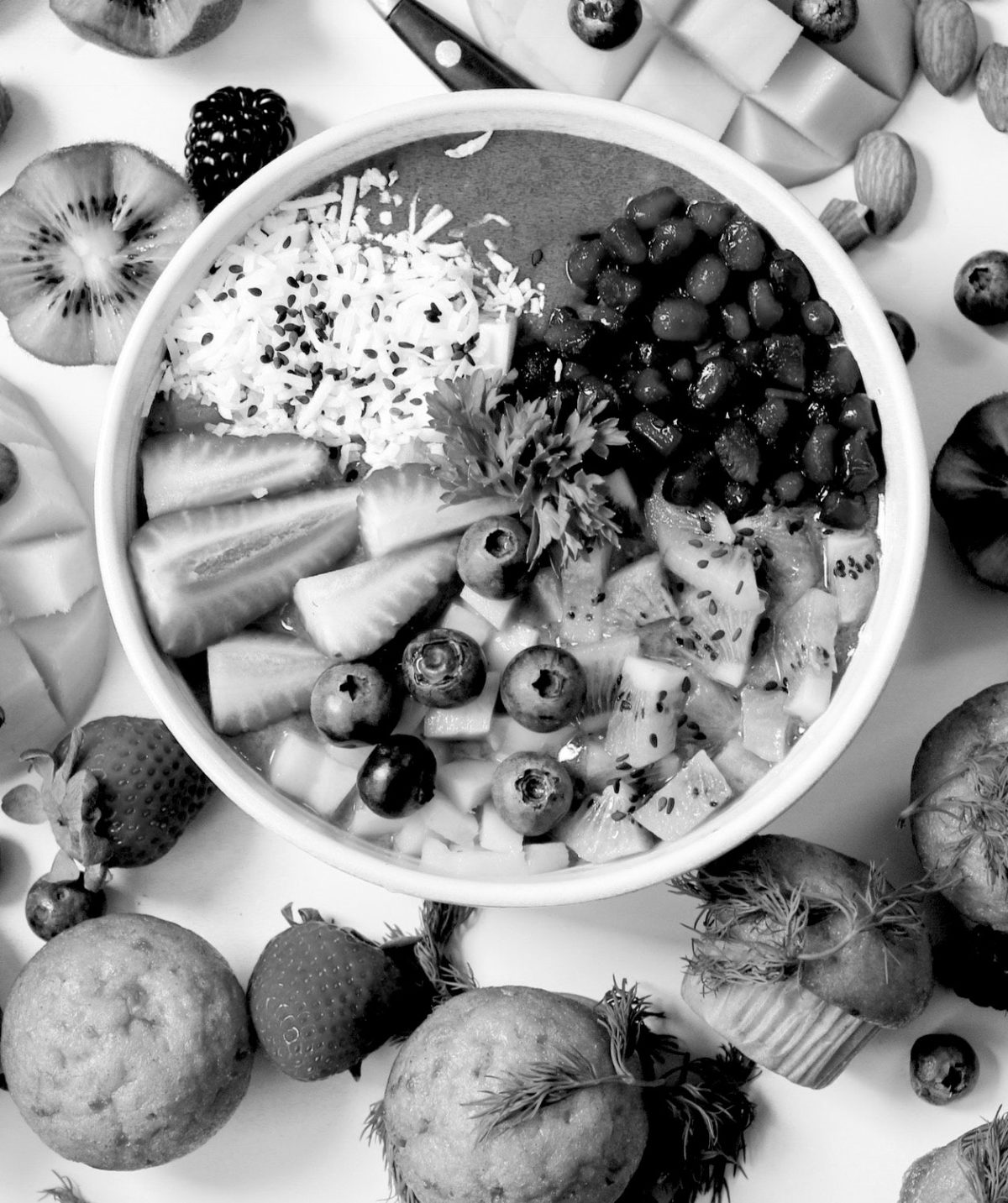 fitness and nutrition hacks a bowl of healthy fruit surrounded with muffins